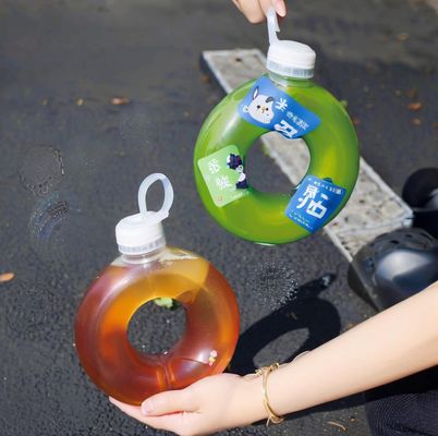 Custom Shape Plastic Juice Bottle 550ml PP Donut Shaped Juice PETG Milk Tea Plastic Bottle with Pull Ring Lid